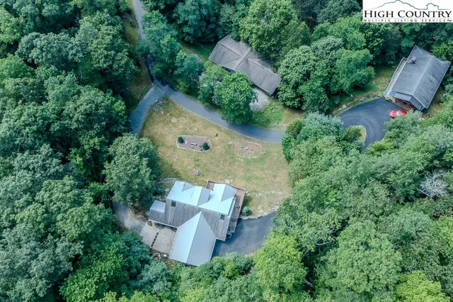 an aerial view of a house with outdoor space and street view