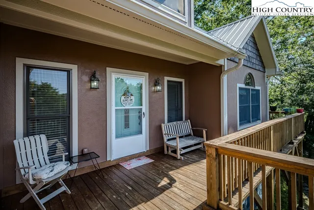 a view of two chairs in the balcony