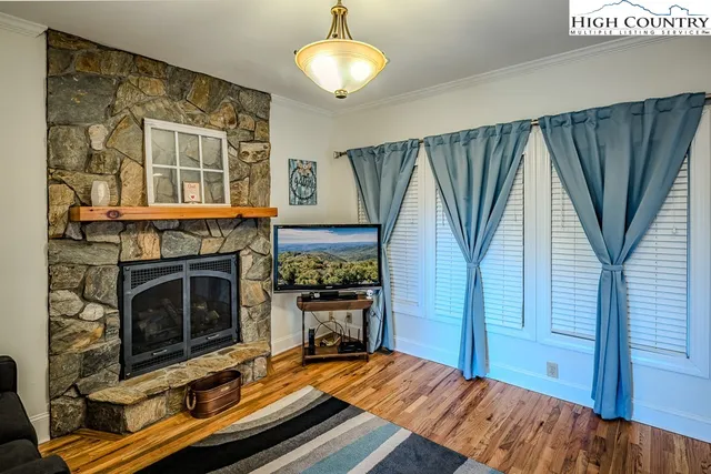 a bedroom with furniture and a fireplace