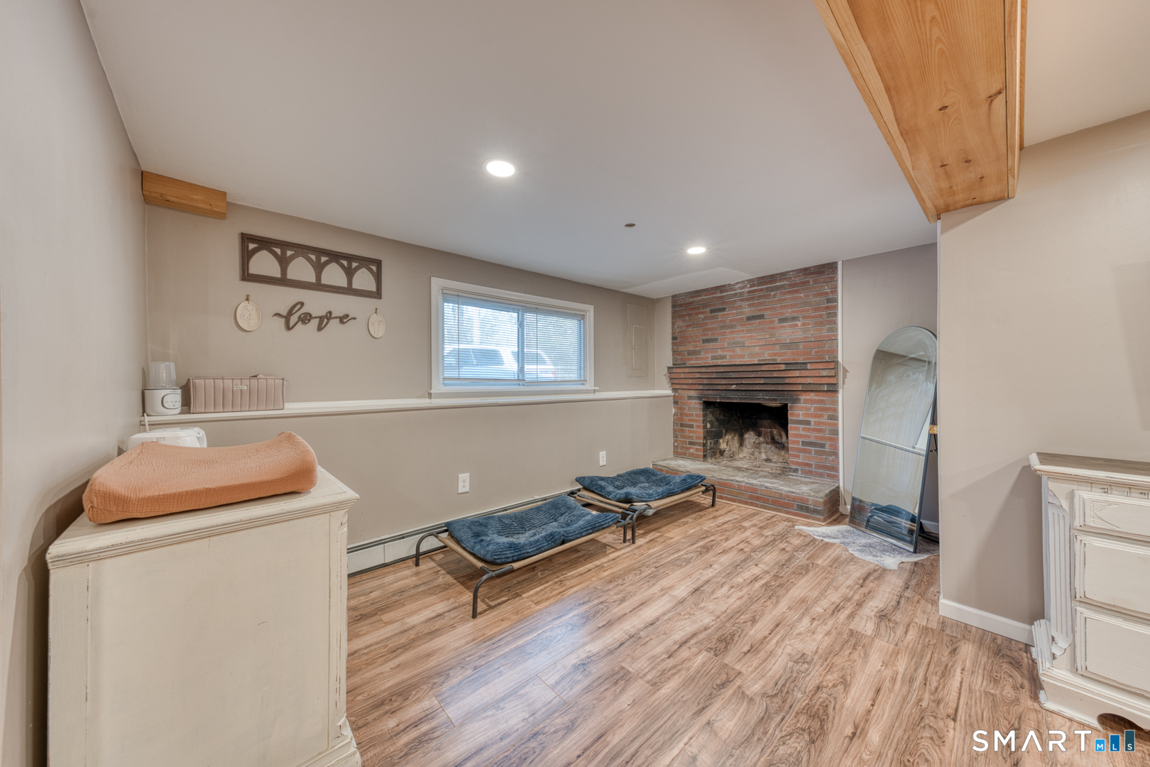 23 Thompson Hill Road Columbia, CT 06237 - Photo 24 of 39 Lower level family room offers nice light and another fireplace