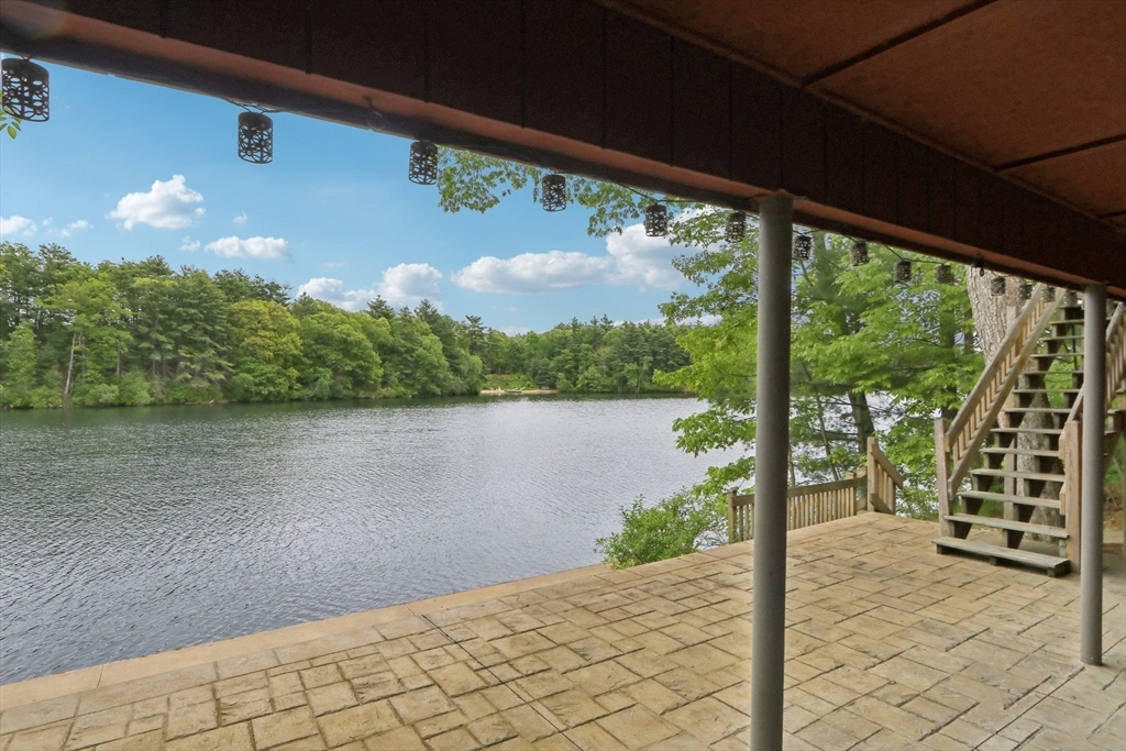 56 Pine Point Road Stow, MA 01775 - Photo 22 of 34 a view of a lake from a balcony