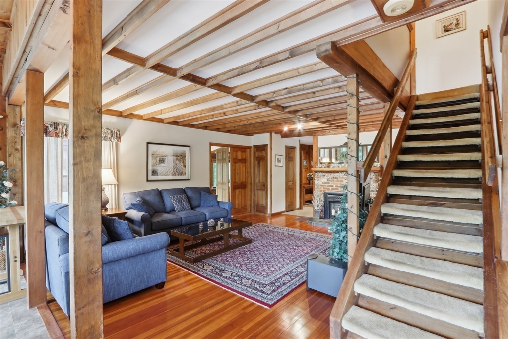 56 Pine Point Road Stow, MA 01775 - Photo 33 of 34 a living room with furniture and wooden floor