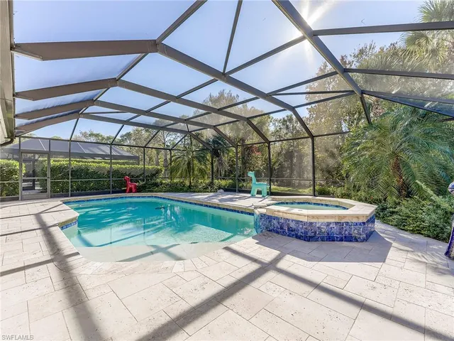 a view of a swimming pool with a patio