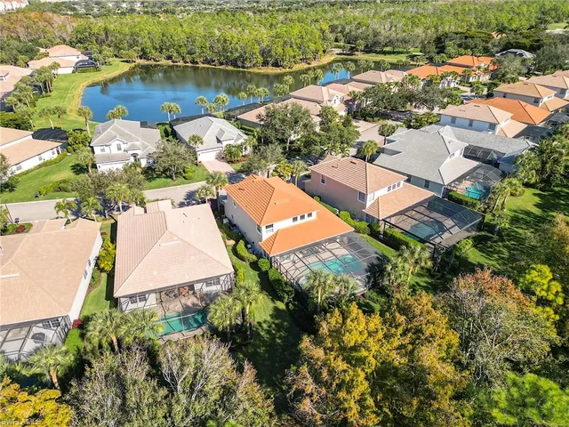 an aerial view of a house with a lake view