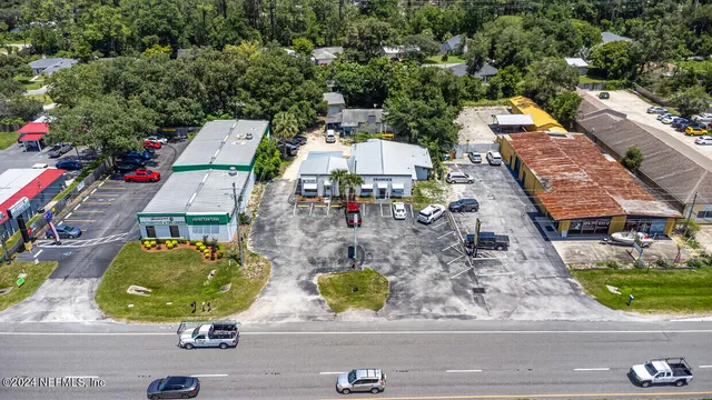 an aerial view of residential houses with outdoor space