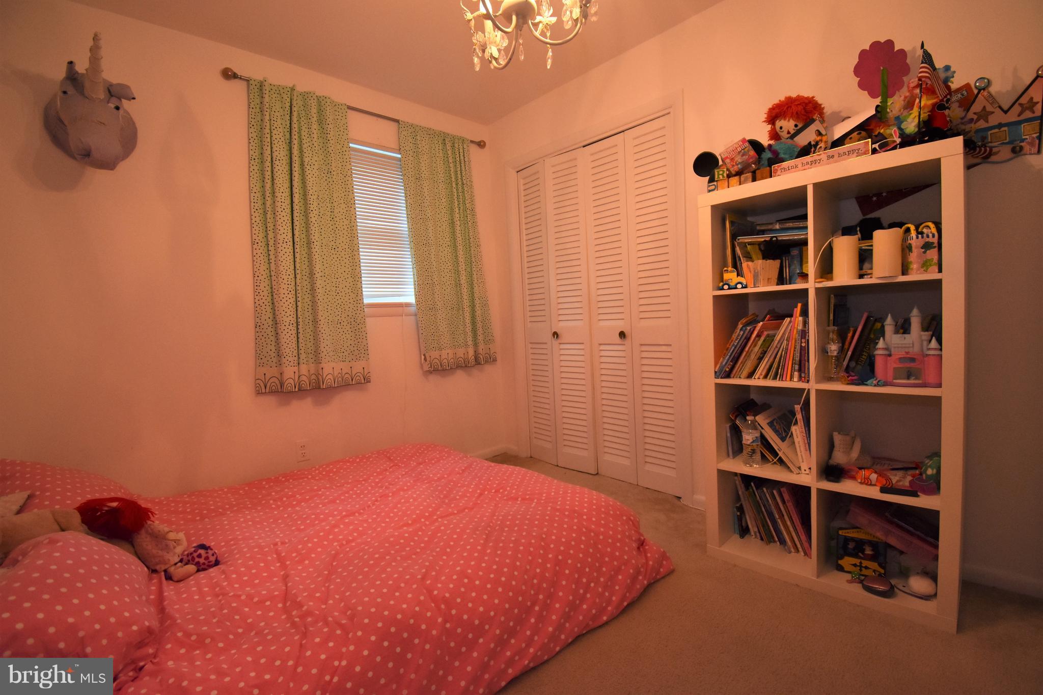 6405 Middleburg Lane Bethesda, MD 20817 - Photo 17 of 21 a bedroom with a bed and a closet