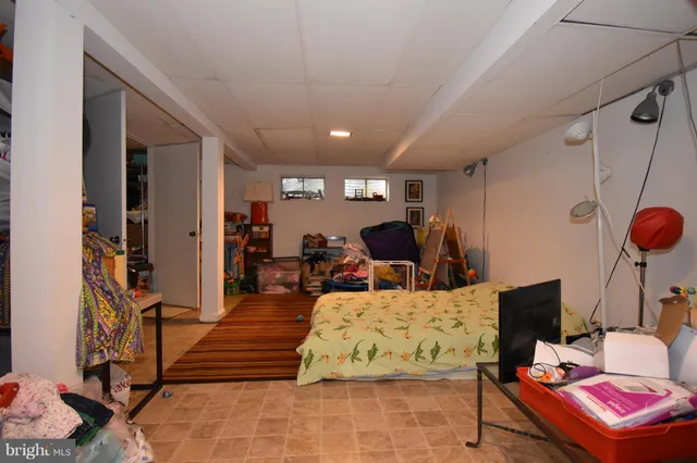 a bedroom with furniture and a chandelier