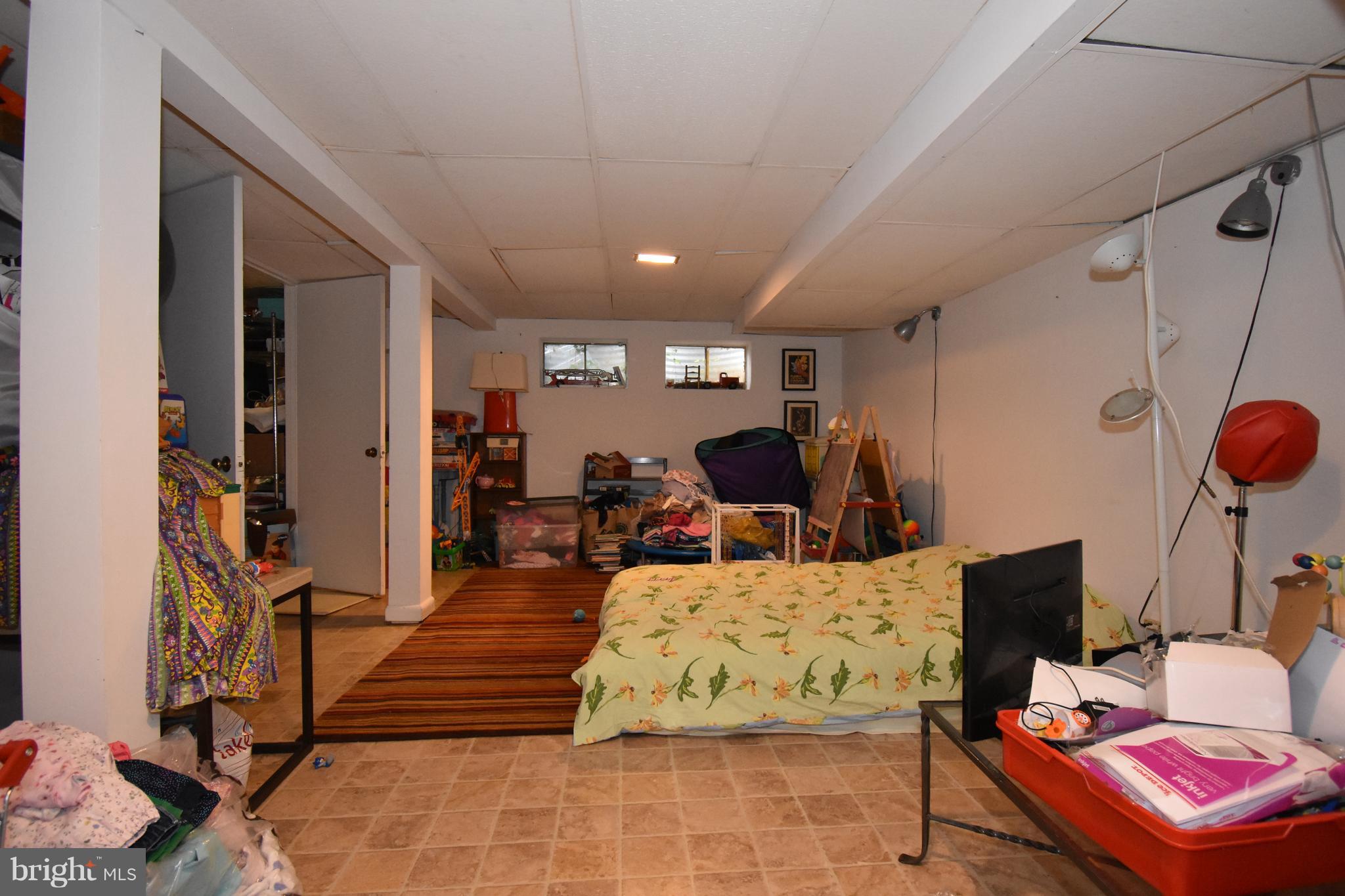 6405 Middleburg Lane Bethesda, MD 20817 - Photo 19 of 21 a bedroom with furniture and a chandelier
