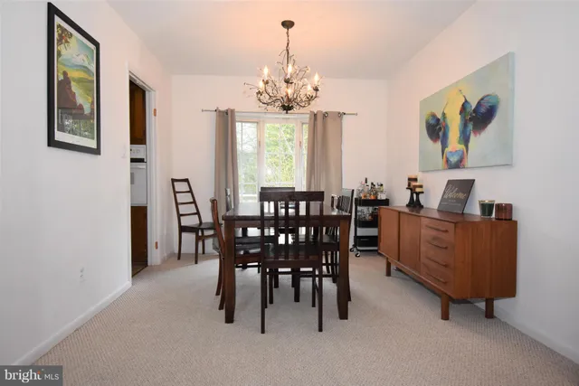 a view of a dining room with furniture window and chandelier