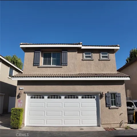 a front view of a house with a garage
