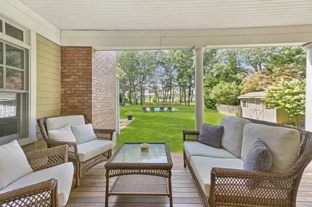 a living room with furniture and a yard