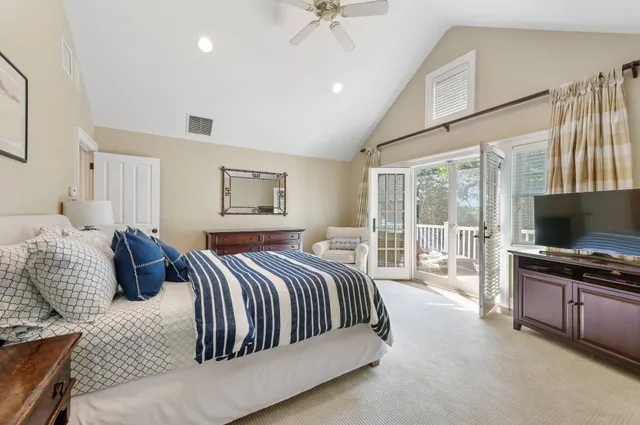 a spacious bathroom with a double vanity sink mirror and a bathtub