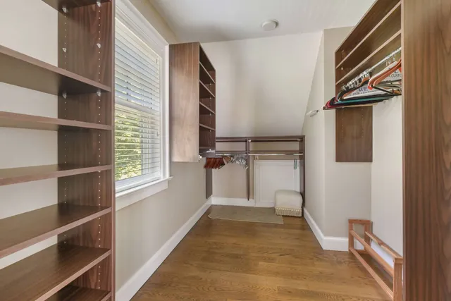 a view of a two chairs and table in the balcony