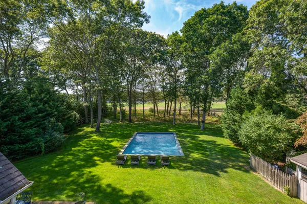a bedroom with a large bed and a large window