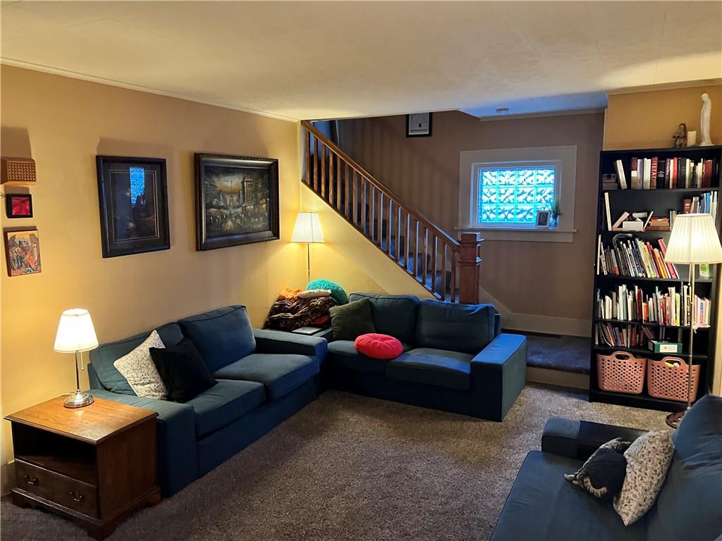 4 East Ridge Avenue Greenville, PA 16125 - Photo 6 of 24 a living room with furniture book shelf and wooden floor
