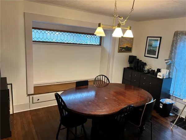 a dining room with furniture and window
