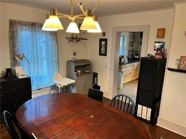 a dining room with furniture and window
