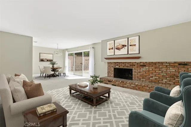a living room with furniture wooden floor and a fireplace
