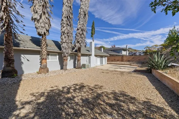 a view of a backyard of a house