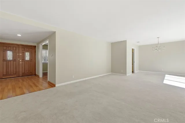a view of an empty room with glass door