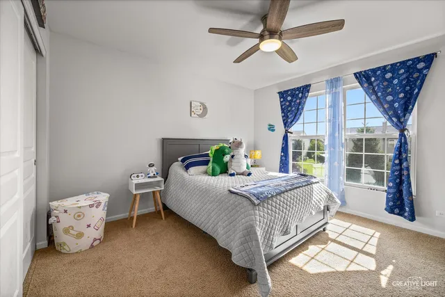 a bedroom with a bed and window
