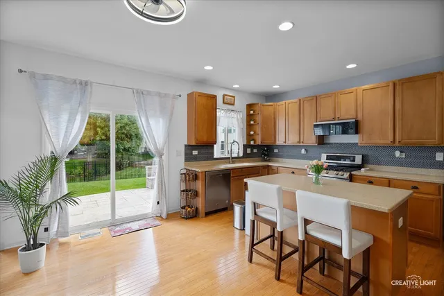 a kitchen with a window a sink and appliances