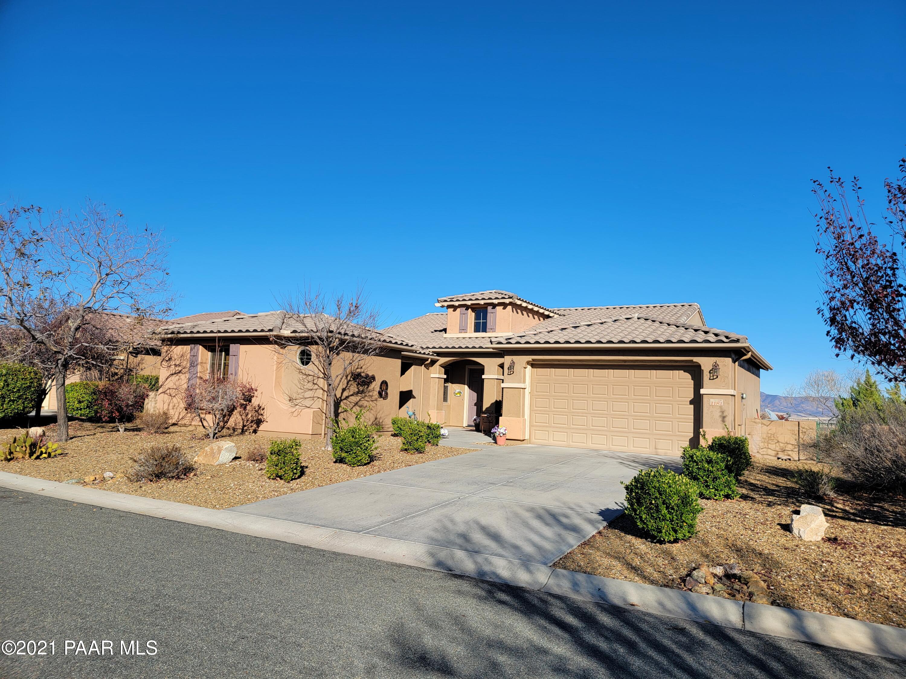 1181 Stack Rock Road Prescott Valley, AZ 86314 - Photo 1 of 25 a front view of a house with a yard