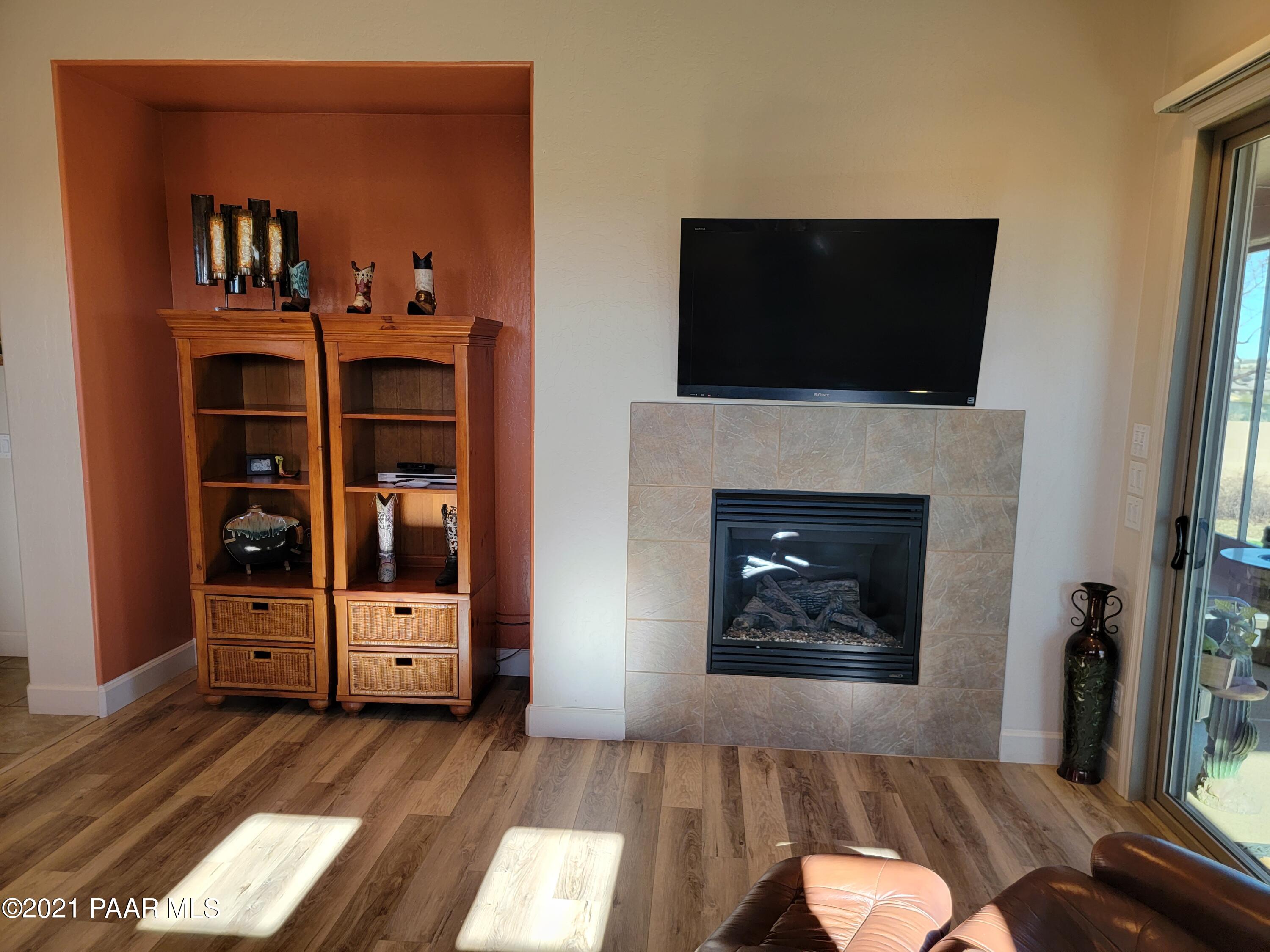 1181 Stack Rock Road Prescott Valley, AZ 86314 - Photo 11 of 25 a living room with furniture and a fireplace