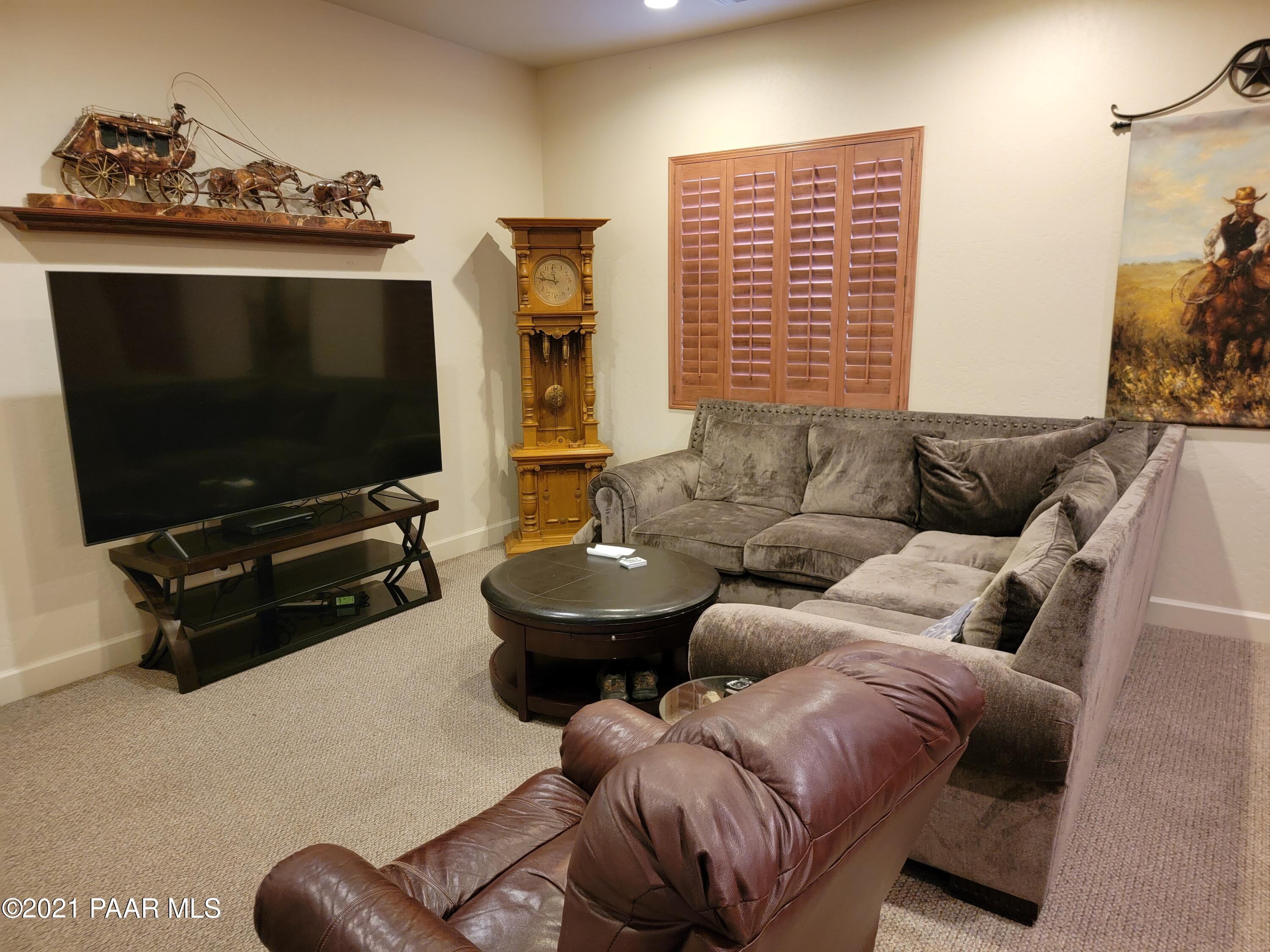 1181 Stack Rock Road Prescott Valley, AZ 86314 - Photo 19 of 25 a living room with furniture and a flat screen tv