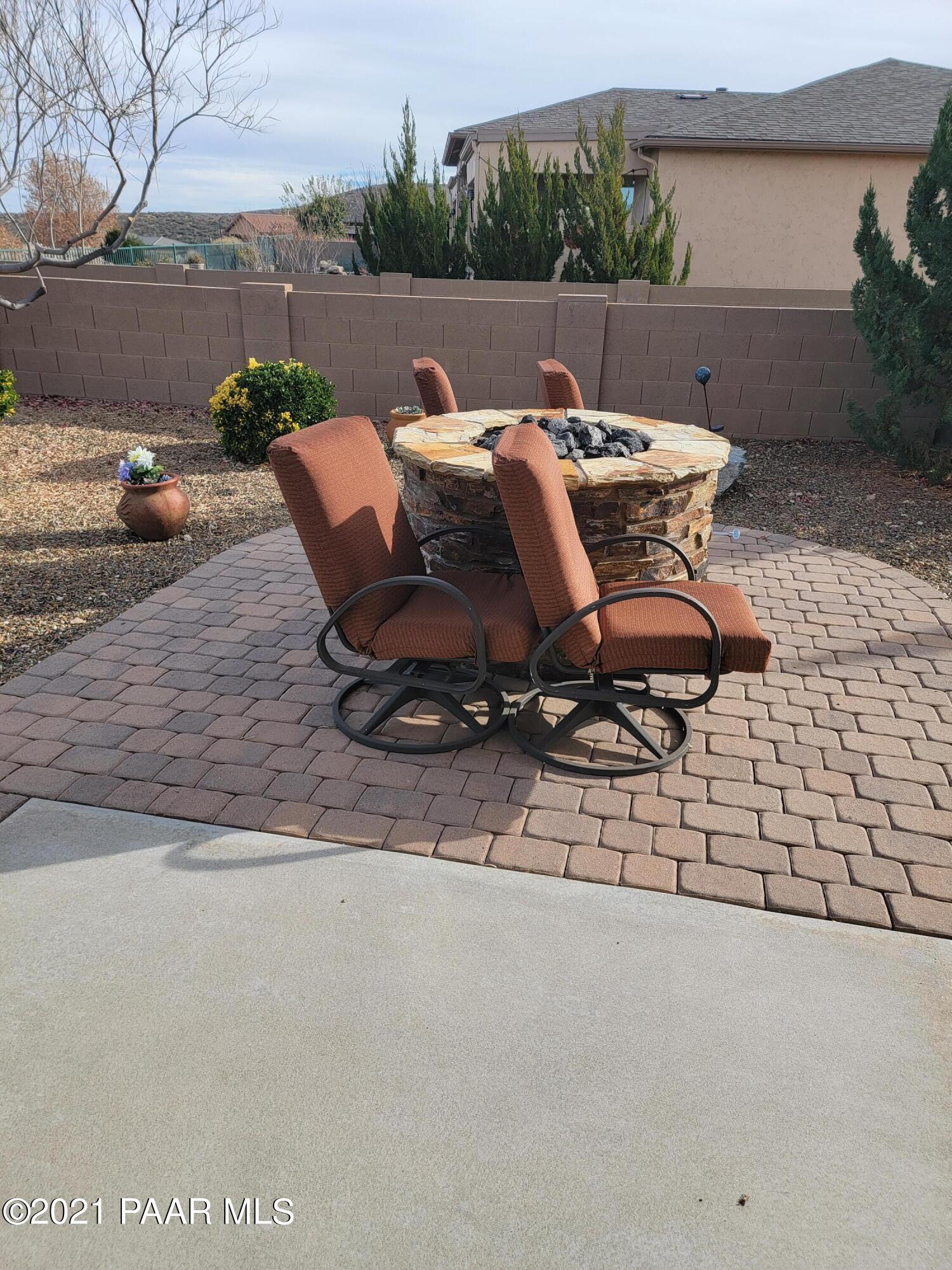 1181 Stack Rock Road Prescott Valley, AZ 86314 - Photo 24 of 25 a view of backyard with seating space and trees
