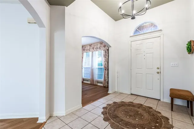 a bedroom with a bed and a chair