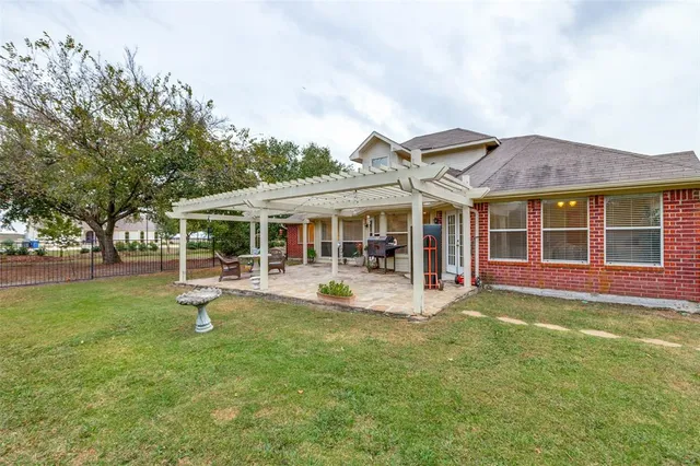 a view of a house with swimming pool and sitting area