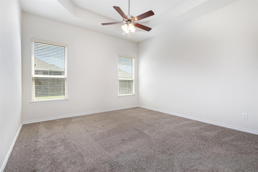 516 Maverick Street Anna, TX 75409 - Photo 14 of 28 an empty room with windows and fan