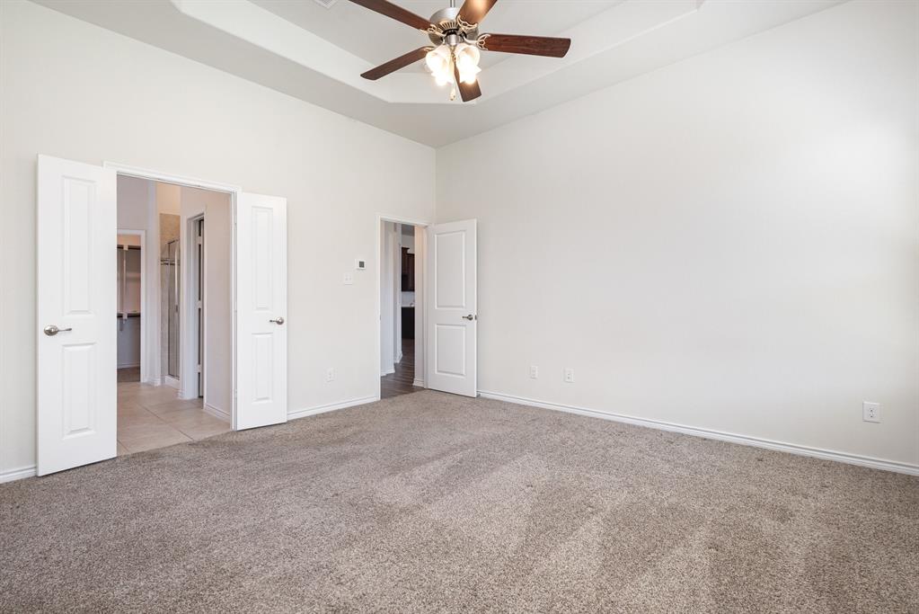 516 Maverick Street Anna, TX 75409 - Photo 15 of 28 a view of a livingroom with a ceiling fan and window