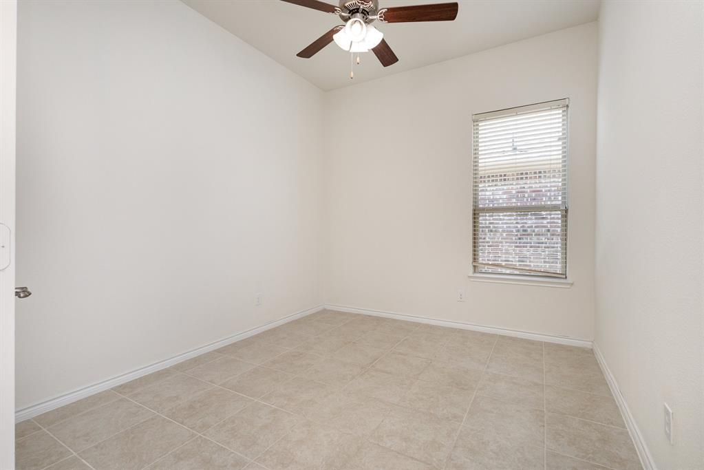 516 Maverick Street Anna, TX 75409 - Photo 18 of 28 an empty room with a window and a fan