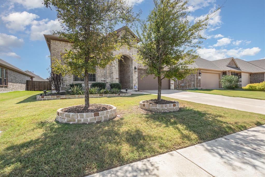 516 Maverick Street Anna, TX 75409 - Photo 2 of 28 a swimming pool with yard in front of it