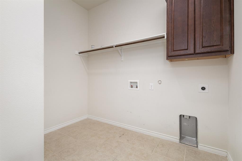 516 Maverick Street Anna, TX 75409 - Photo 24 of 28 a view of a room with rack on the wall