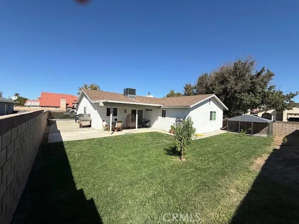 a front view of a house with yard