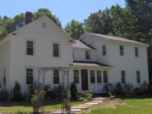 54 Under Mountain Road Lenox, MA 01240 - Photo 2 of 8 a front view of a house with yard and green space