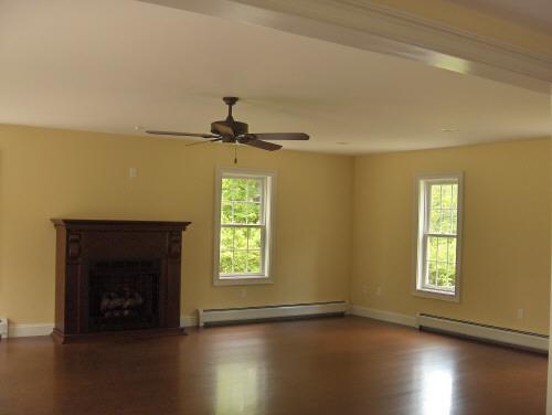 54 Under Mountain Road Lenox, MA 01240 - Photo 5 of 8 a view of an empty room with wooden floor and a window