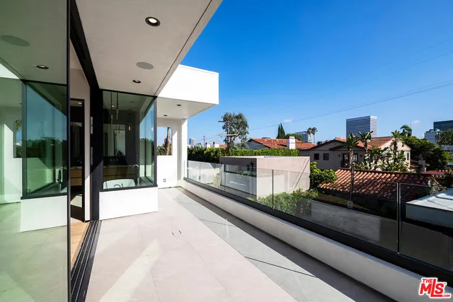 a view of a balcony with city view