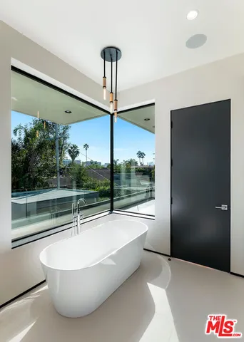 a bathroom with a bathtub and shower