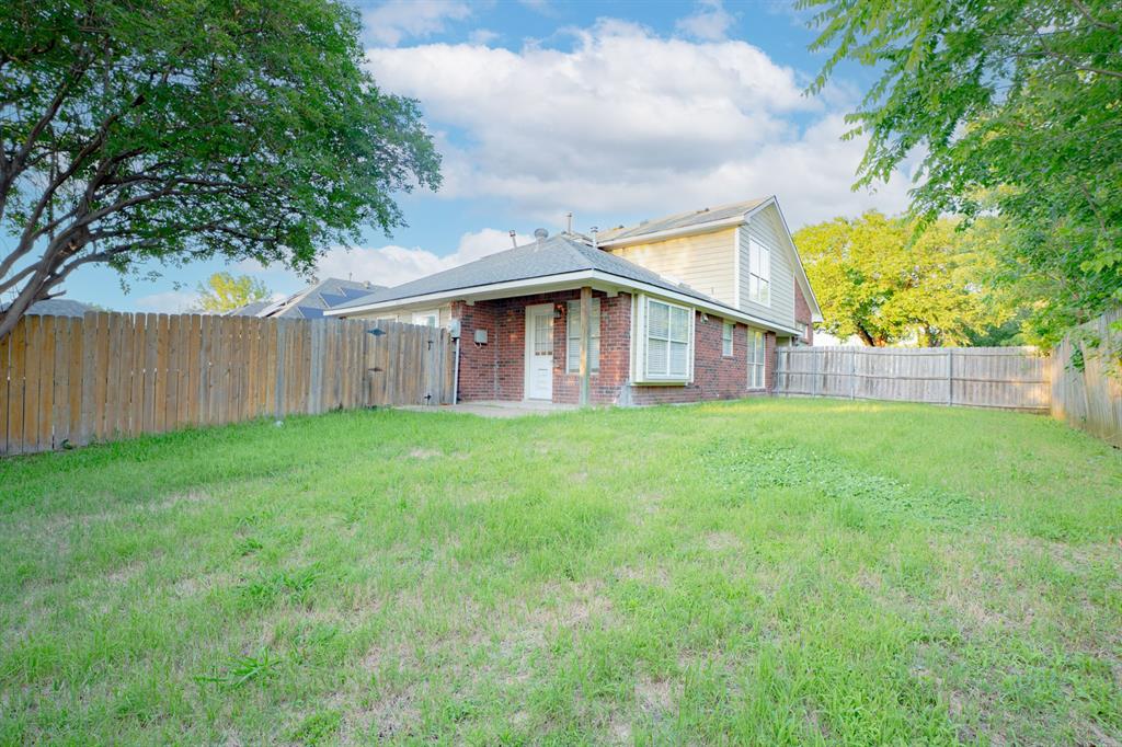 3721 Smartt Street Rowlett, TX 75088 - Photo 23 of 27 a view of a house with backyard and a tree