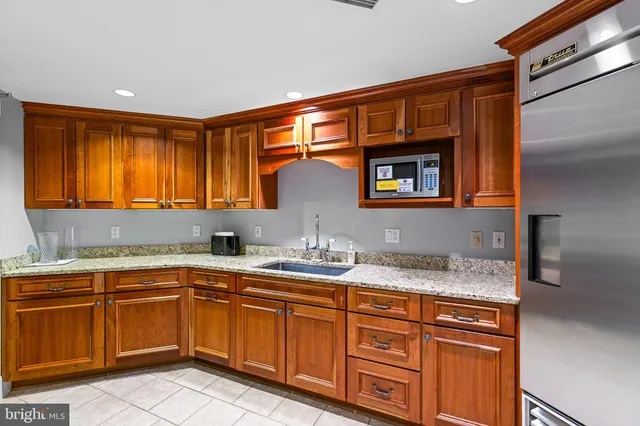 a living room with furniture kitchen and a table