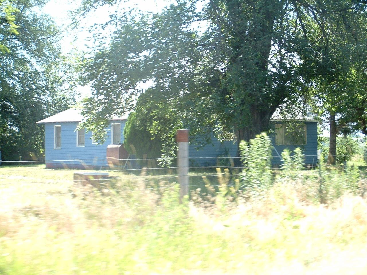 1701 Maple Grove Road Sunnyside, WA 98944 - Photo 2 of 3 a view of pool with two trees in the background