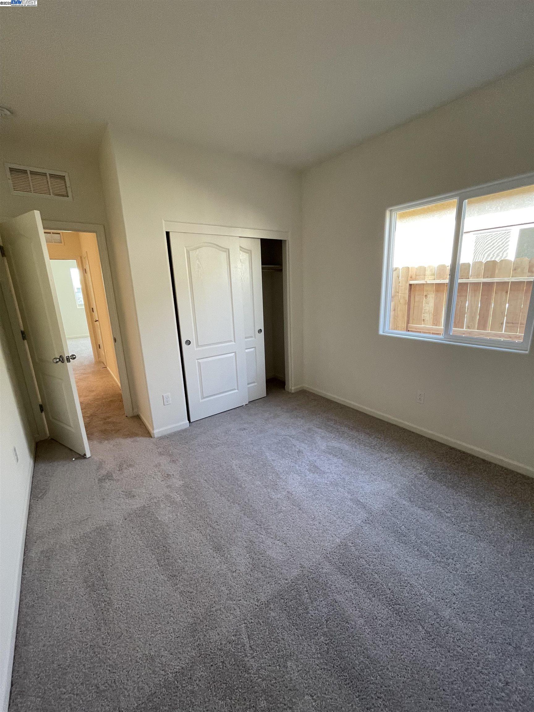 4246 Freemark Avenue Merced, CA 95348 - Photo 16 of 27 an empty room with a window