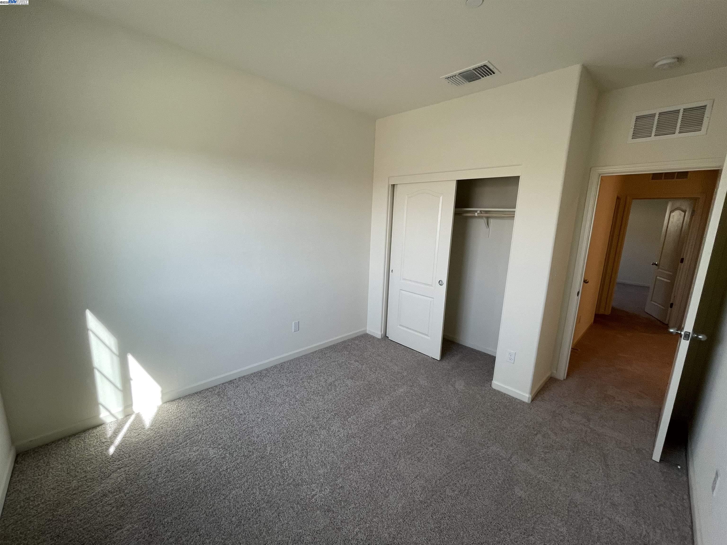 4246 Freemark Avenue Merced, CA 95348 - Photo 17 of 27 an empty room with windows