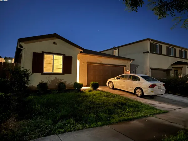 a view of a car parked in front of a house