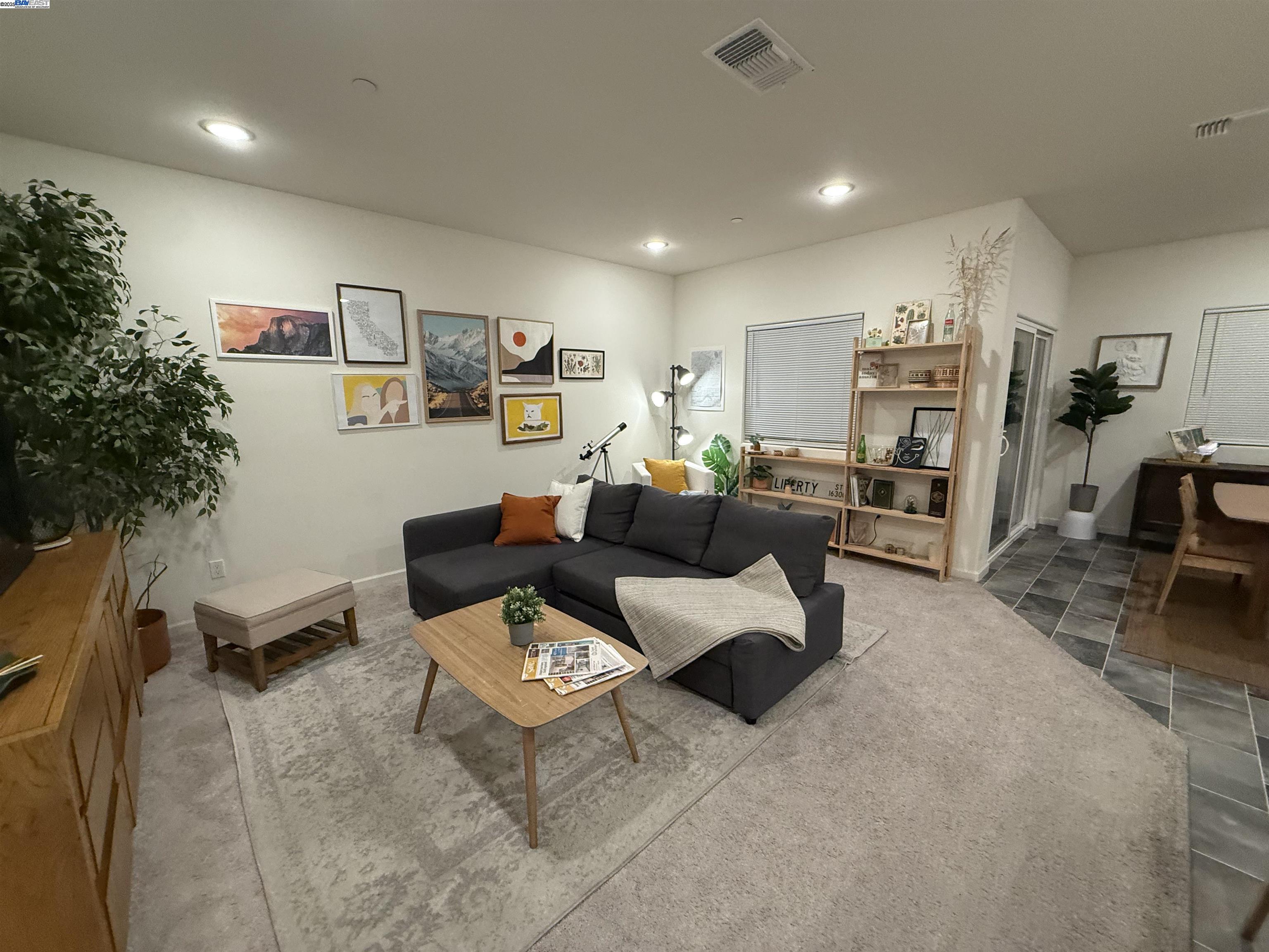 4246 Freemark Avenue Merced, CA 95348 - Photo 3 of 27 a living room with furniture and a book shelf