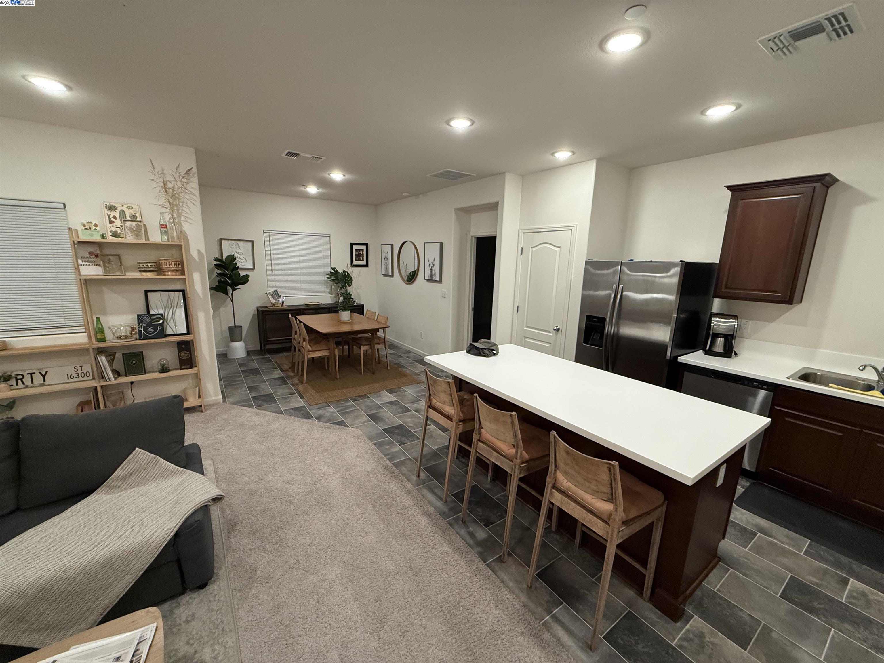 4246 Freemark Avenue Merced, CA 95348 - Photo 4 of 27 a large kitchen with a table and chairs